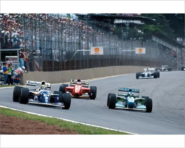 Formula One World Championship: Michael Schumacher Benetton B194 and Ayrton Senna Williams FW16 battle for position