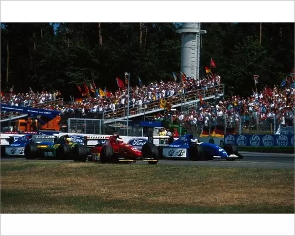 Formula One World Championship: Gerhard Berger Ferrari 412T1B celebrates his victory, closely followed by 2nd and 3rd placed drivers, Olivier Panis