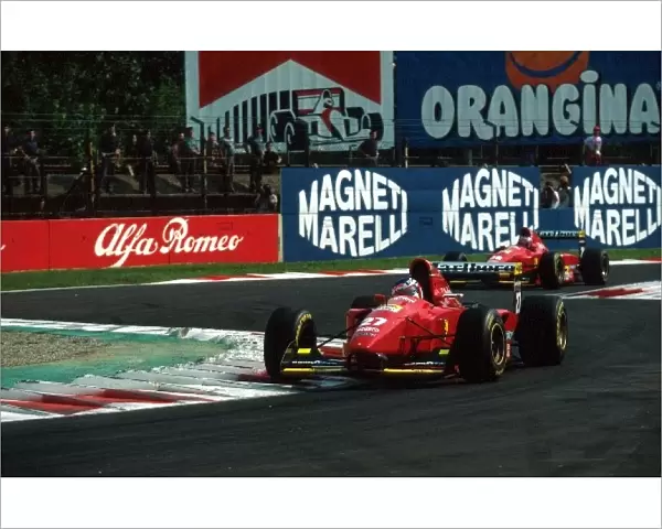 Formula One World Championship: Jean Alesi Ferrari 412T1B who claimed his first pole but retired early in the race leads team mate Gerhard Berger