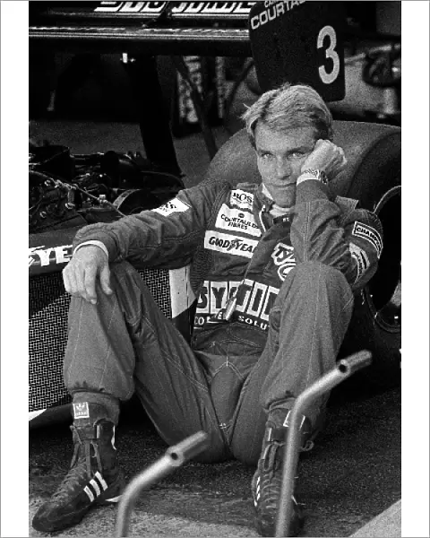 Formula One World Championship: Stefan Johansson relaxes on the rear wheel of his Tyrrell 012 before finishing ninth