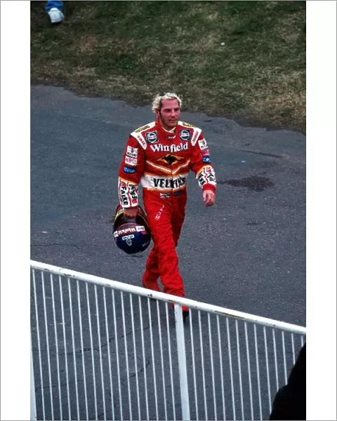 Formula One World Championship: Jacques Villeneuve Williams walks back to the pits
