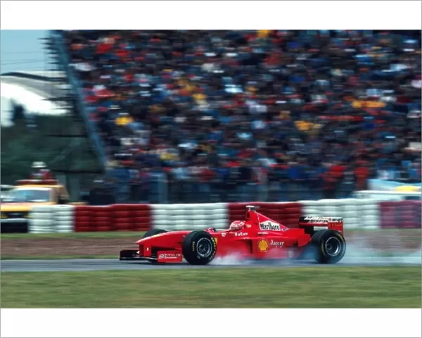 Formula One World Championship: Eddie Irvine Ferrari F300 locks up on his way to 3rd place