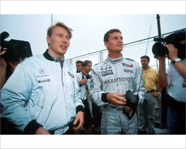 Formula One World Championship: Mika Hakkinen McLaren and David Coulthard McLaren play with radio controlled cars