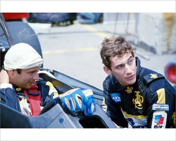 Formula One World Championship: Elio de Angelis Lotus 97T confers with teammate Ayrton Senna