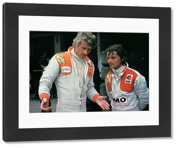 Formula One World Championship: Tenth placed Jean-Pierre Jabouille talks with his Renault team mate Rene Arnoux, who spun out of the race on lap 29