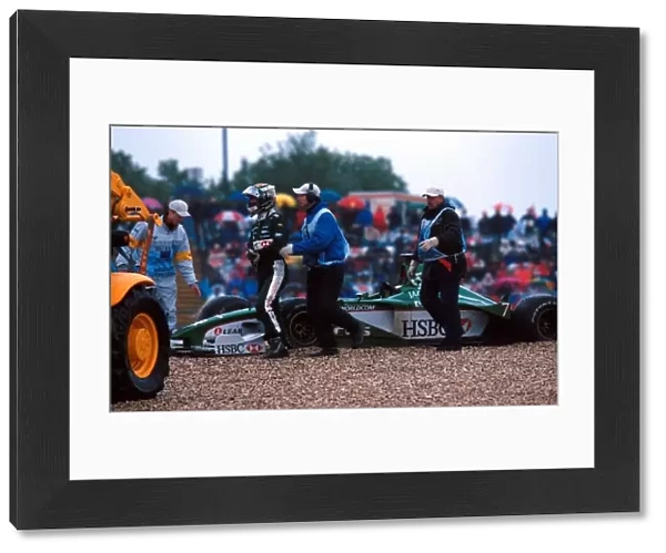 Formula One World Championship: Eddie Irvine Jaguar Cosworth R1 retires from the race