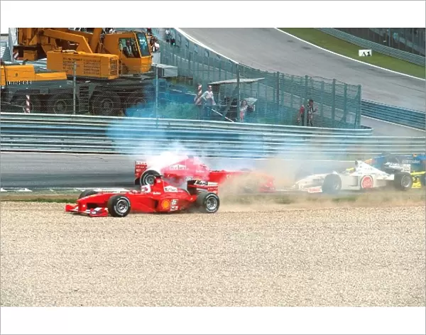 Formula One World Championship: Schumacher spins out after an incident with Zonta at the start