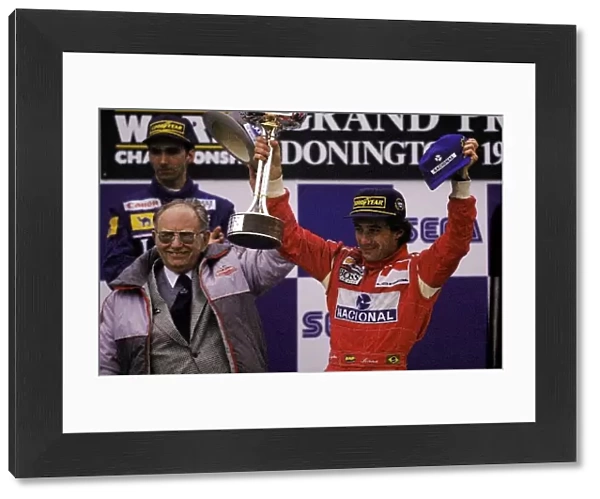 Formula One World Championship: Tom Wheatcroft Donington Circuit Owner congratulates Ayrton Senna McLaren on the podium after arguably his greatest