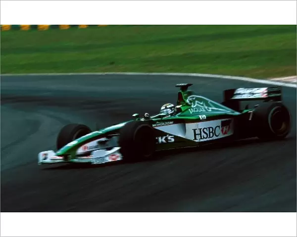 Formula One World Championship: Eddie Irvine Jaguar Cosworth R1 spins and fails to finish