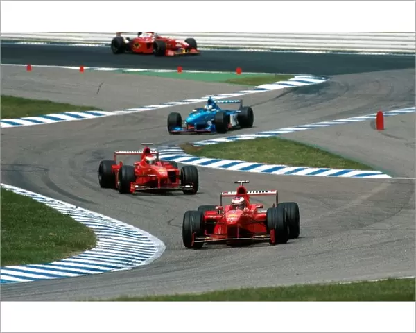 Formula One World Championship: Michael Schumacher, Ferrari F300, 5th place, leads team-mate Eddie Irvine, Ferrari F300