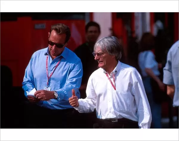 Formula One World Championship: Bernie Ecclestone F1 Supremo with Paddy Mcnally in the paddock