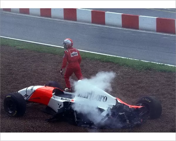 Formula One World Championship: Michael Andretti gets out of his McLaren Ford MP4  /  8 after being involved in a first corner accident