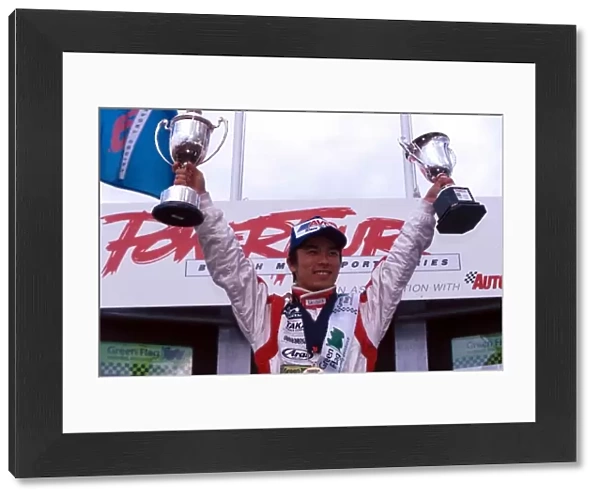 British Formula Three Championship: Race winner Takuma Sato Carlin Motorsport celebrates on the podium after taking his first Formula Three victory