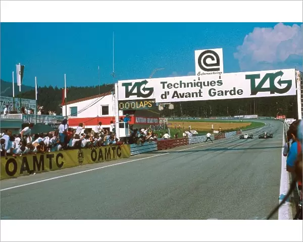 Formula One World Championship: Winner Elio de Angelis Lotus 91 takes the flag. 05 of a sec ahead of Keke Rosberg, the closest finish in GP history