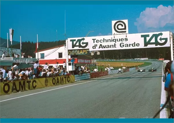 Formula One World Championship: Winner Elio de Angelis Lotus 91 takes the flag. 05 of a sec ahead of Keke Rosberg, the closest finish in GP history