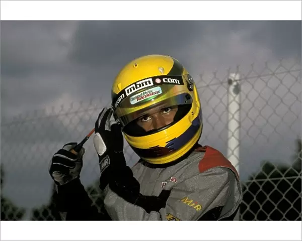 World Karting Championships: Lewis Hamilton makes an adjustment to his helmet
