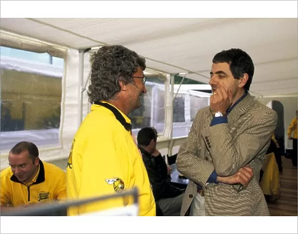 Formula One World Championship: L-R: Eddie Jordan Jordan team owner with Rowan Atkinson Actor and comedian