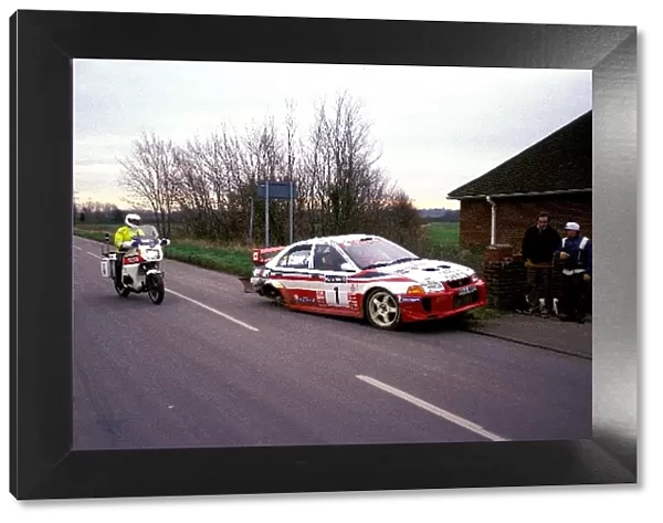 World Rally Championship: Tommi Makinen Mitsubishi Lancer is pulled over by the British Police for running on the road with only three wheels
