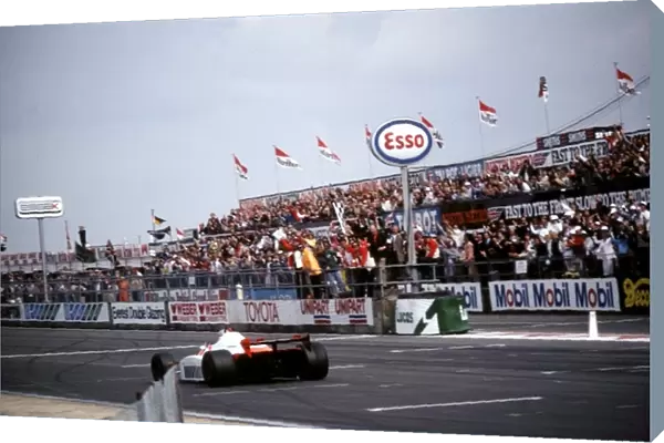 Formula One World Championship: John Watson Mclaren MP4 takes the flag to win the first Grand Prix for Ron Dennis newly acquired Mclaren team