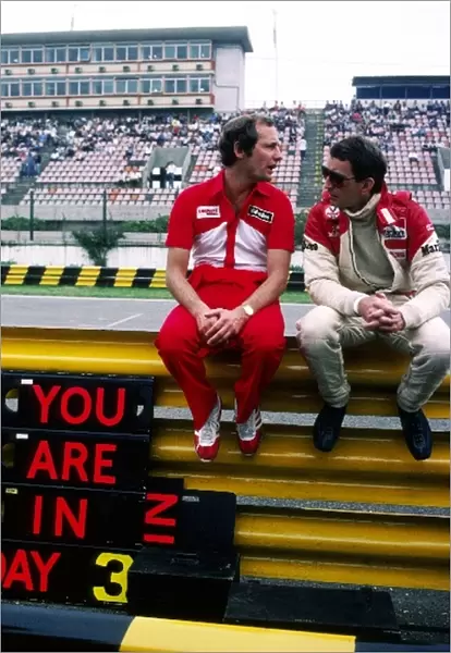 Formula One World Championship: Ron Dennis McLaren Team Owner talks with John Watson McLaren, who retired from the race on lap 37 with a crown wheel