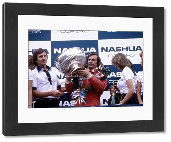 Formula One World Championship: Race winner Carlos Reutemann, Williams, with his trophy on the podium