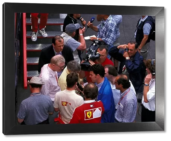 Formula One World Championship: Race winner Michael Schumacher Ferrari is interviewed by the media, including ITV F1 pit lane reporter James Allen