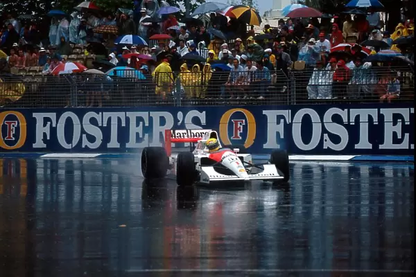 Formula One World Championship: Race winner Ayrton Senna McLaren MP4  /  6 leads in the appalling conditions that stopped the race after 14 of the