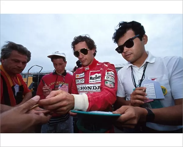 Formula One World Championship: Winner Ayrton Senna McLaren MP4  /  6 signs autographs for the fans