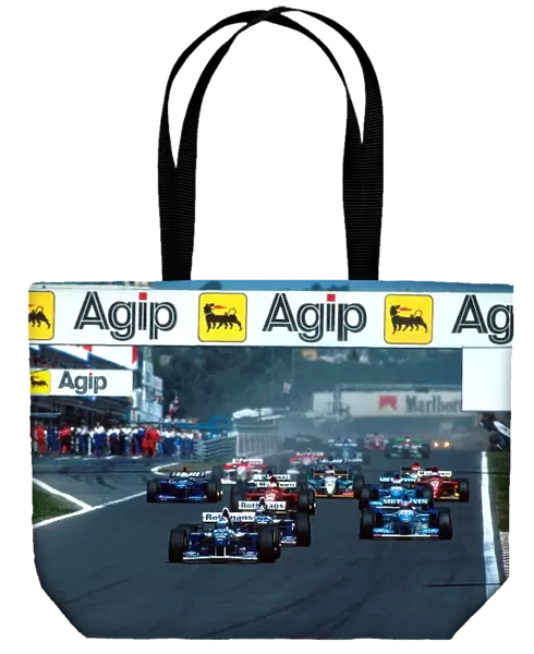 Formula One World Championship: David Coulthard leads at the start of the race whilst Katayama and Badoer collide at the back of the grid