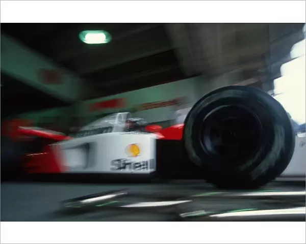 Formula One World Championship: Gerhard Berger McLaren MP4  /  6 leaves the pits during qualifying