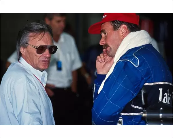 Formula One World Championship: Nigel Mansell, right, talks with Bernie Ecclestone