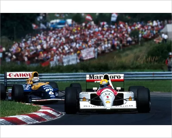 Formula One World Championship: Race winner Ayrton Senna McLaren MP4  /  6 leads Riccardo Patrese