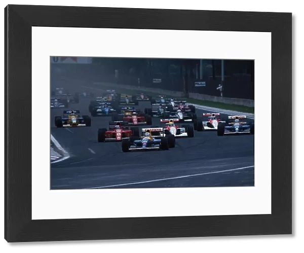 Formula One World Championship: Nigel Mansell Williams FW14 leads the field at the start of the race