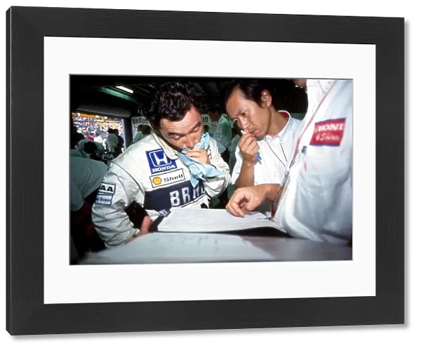 Formula One World Championship: Satoru Nakajima Tyrrell confers with his engineers on the occasion of his final Grand Prix