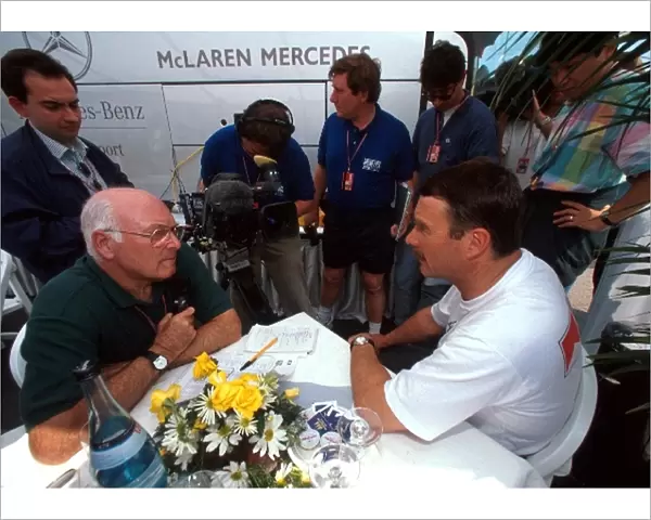 Formula One World Championship: BBC TV Commentator Murray Walker talks with Nigel Mansell who finished tenth in his first race with McLaren