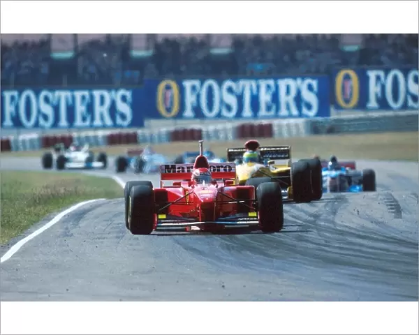 Formula One World Championship: Eddie Irvine Ferrari F310B, 2nd place, Giancarlo Fisichella Jordan 197