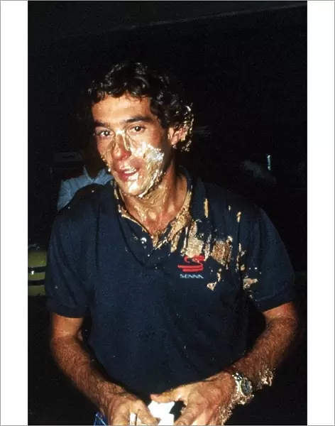 Formula One World Championship: Race winner Ayrton Senna McLaren celebrates his thirty-first birthday on the 21 March with a cake in his face