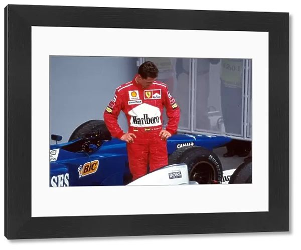 Formula One World Championship: Michael Schumacher, Ferrari F310B 5th place spent 10 minutes looking at the McLaren