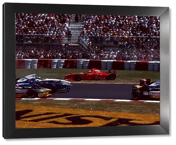 Formula One World Championship: Eddie Irvine, Ferrari F310B, DNF comes off worst in the scramble for turn 1