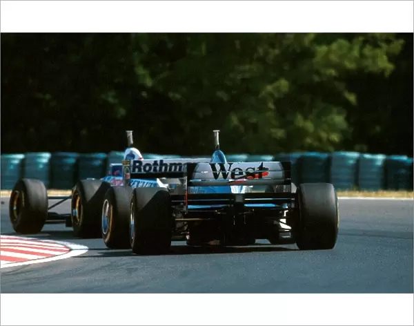 Formula One World Championship: Winner Jacques Villeneuve Williams FW19 leads David Coulthard Mclaren