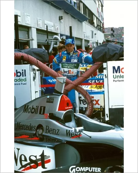 Formula One World Championship: Gerhard Berger looks longingly at the Mclaren
