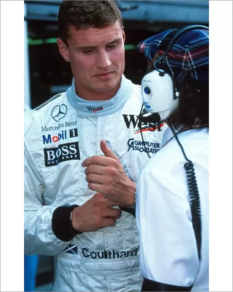 Formula One World Championship: Winner David Coulthard Mclaren MP4-12 with Jackie Stewart