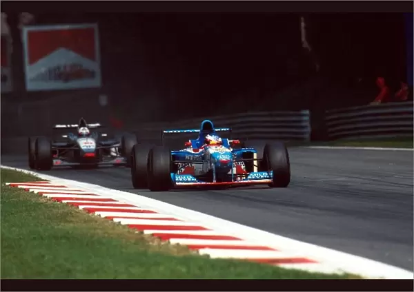 Formula One World Championship: Jean Alesi Benetton B197 leads David Coulthard Mclaren