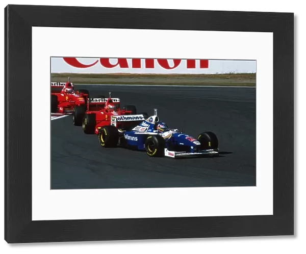 Formula One World Championship: Jacques Villeneuve Williams FW19 leads the Ferraris of Irvine and Schumacher