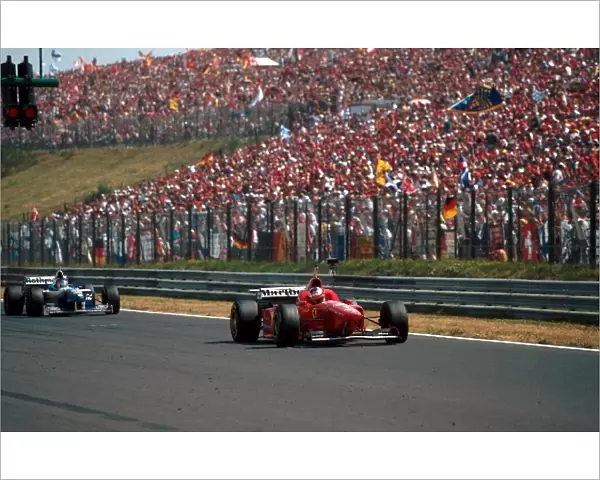 Formula One World Championship: Michael Schumacher Ferrari F310 gets pole position in front of another huge crowd