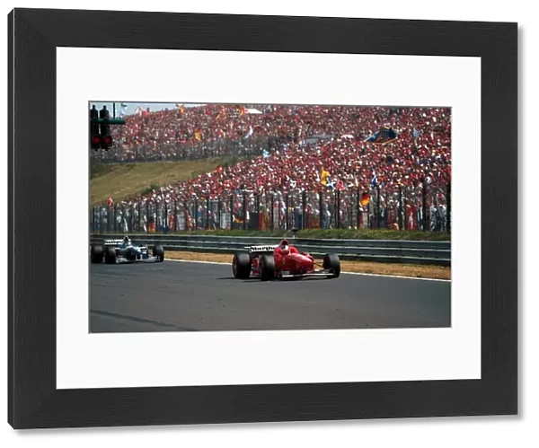 Formula One World Championship: Michael Schumacher Ferrari F310 gets pole position in front of another huge crowd