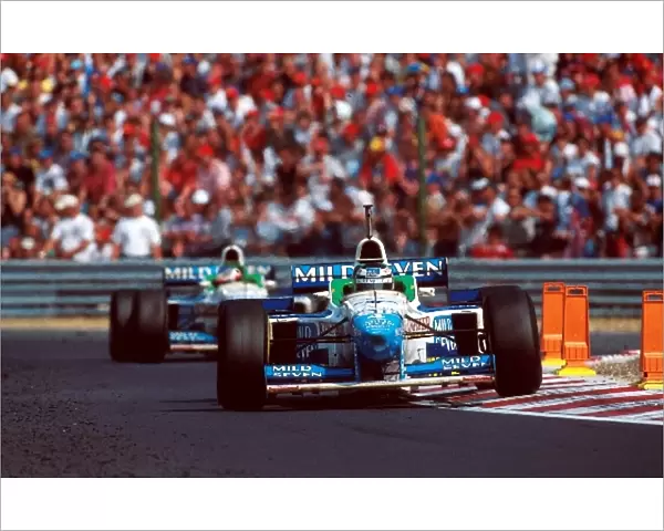 Formula One World Championship: Gerhard Berger Benetton B196 leads team mate Alesi only to have another engine failure