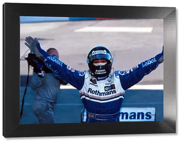 Formula One World Championship: Race winner Damon Hill Williams FW18 is able to celebrate his winning of the world Championship