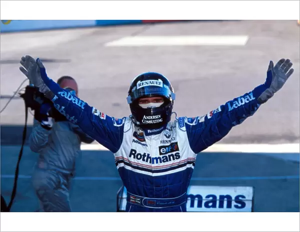 Formula One World Championship: Race winner Damon Hill Williams FW18 is able to celebrate his winning of the world Championship