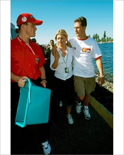 Formula One World Championship: Ralf Schumacher with Corinna Schumacher and Michael Schumacher Ferrari